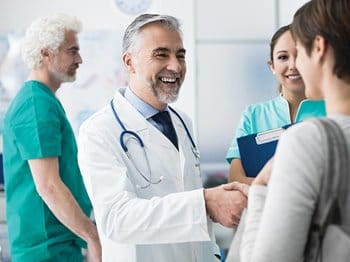 Patient shaking doctor's hand