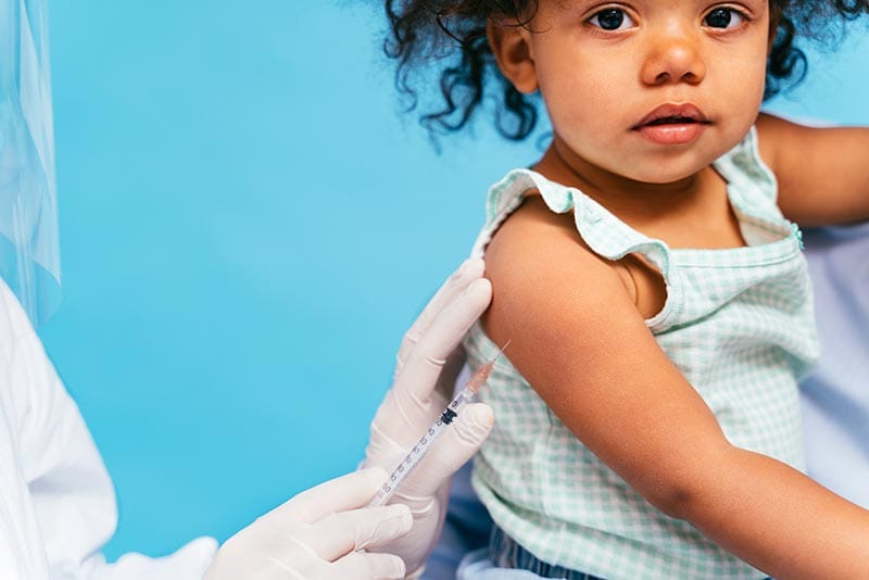 Young child getting vaccine