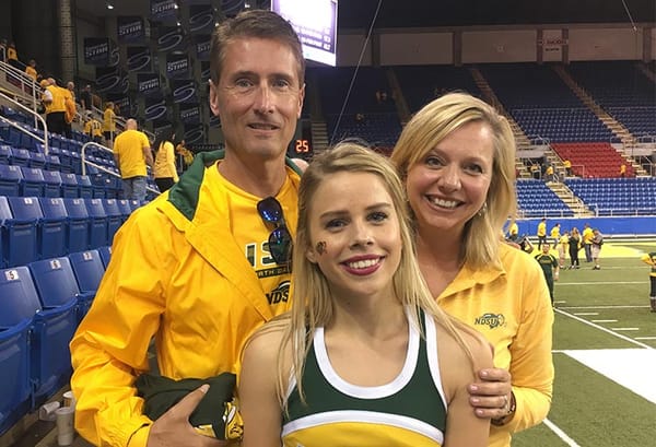 Ellie Helm with parents